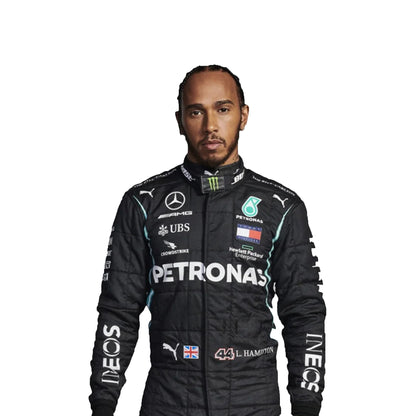 Person wearing a Formula 1 racing suit with various sponsor logos on a white background