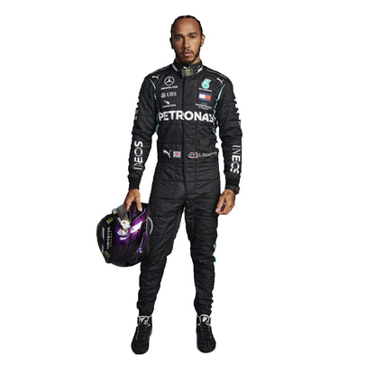 Person wearing a black racing suit with various sponsor logos on a white background