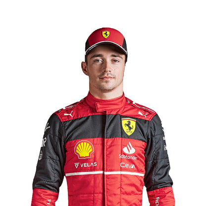 Person wearing a red and black racing suit with various sponsor logos on a white background