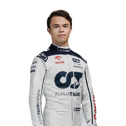 Person wearing a racing suit with various sponsor logos on a white background