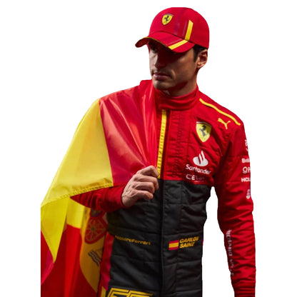 Person wearing a red and yellow racing suit with a cap, standing against a white background