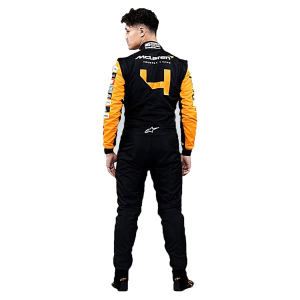 2024 Lando Norris McLaren F1 Racing Suit Kit featuring papaya orange and dark charcoal race suit, black and orange racing gloves, and low-profile driving shoes