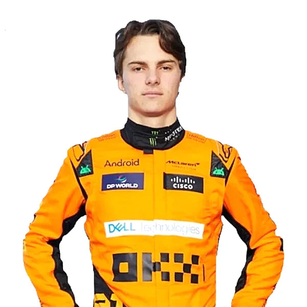 2024 Oscar Piastri McLaren F1 Racing Suit Kit featuring papaya orange and dark charcoal race suit, black and orange racing gloves, and low-profile driving shoes