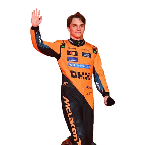 2025 Oscar Piastri F1 Race Suit Kit featuring papaya orange and dark charcoal race suit, black and orange racing gloves, and low-profile driving shoes