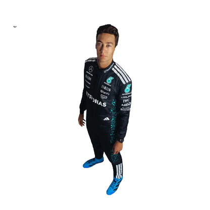 Person wearing a black racing suit with various sponsor logos on a white background