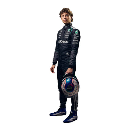 Person wearing a racing suit with various sponsor logos on a white background