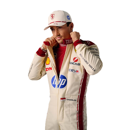 Person wearing a racing suit with various sponsor logos on a white background