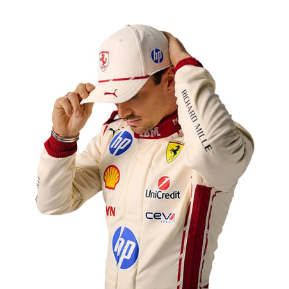 Person wearing a racing suit with various sponsor logos on a white background