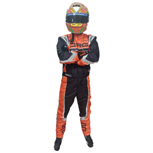 Person wearing an orange and black racing suit with a helmet on a white background