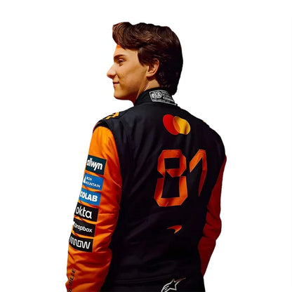 2026 Oscar Piastri F1 Race Suit Set featuring papaya orange and black race suit, black and orange racing gloves, and low-profile driving shoes