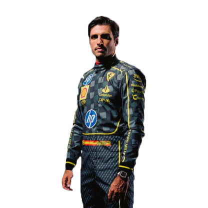 Person wearing a racing suit with various sponsor logos on a white background
